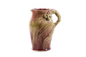 Remued drip glaze pottery jug with applied gumnut and leaf decoration