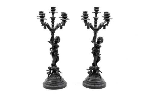Pair of reproduction French Baroque cast metal cherub candelabra
