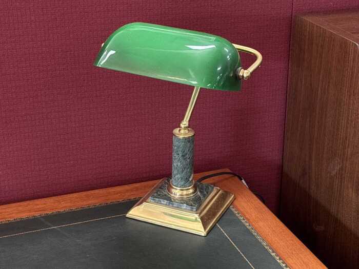 Marble and brass banker's desk lamp with green shade.