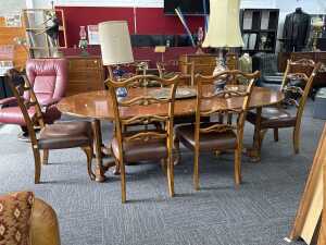 Seven-piece American oak oval extension dining suite