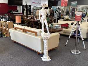 Plaster statue of Michelangelo's David with matching plinth