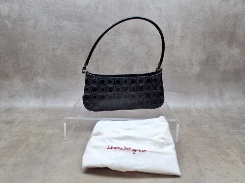 Designer-style embossed leather shoulder bag with silver-tone hardware.