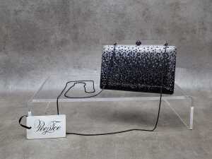 Designer-style black and silver tone clutch bag with black hardware