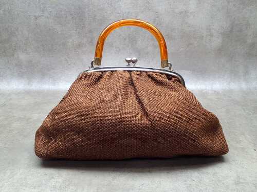 Brown woven fabric handbag with orange Lucite handle and kiss-lock