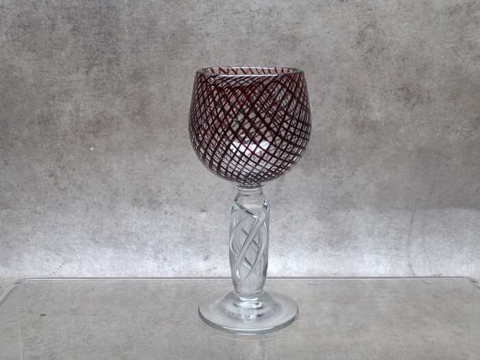 Bohemian-style ruby red wine goblet with air twist stem.
