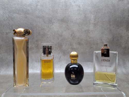 Four vintage designer perfume bottles