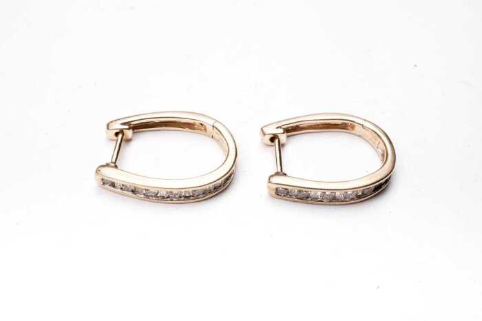 A pair of diamond hoops in 9 carat yellow gold