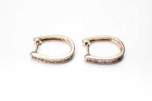 A pair of diamond hoops in 9 carat yellow gold