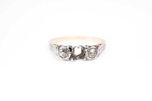 A diamond ring setting in 18 carat yellow gold