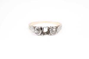 A diamond ring setting in 18 carat yellow gold