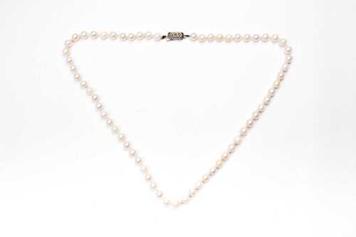 A strand of pearls to a European silver clasp