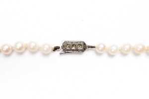 A strand of pearls to a European silver clasp - 3