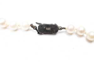 A strand of pearls to a European silver clasp - 4