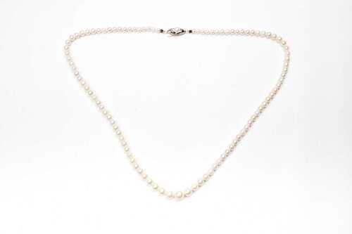 A strand of graduated pearls to a silver clasp