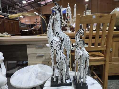 Two resin zebra sculptures