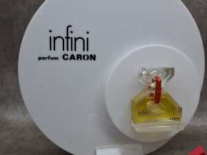 Five perfume shop displays and placards, some with perfume bottles - 2