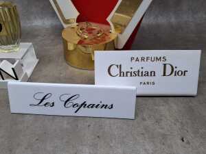 Five perfume shop displays and placards, some with perfume bottles - 4