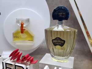 Five perfume shop displays and placards, some with perfume bottles - 5