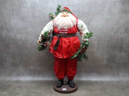 Vintage festive Santa collecting mistletoe