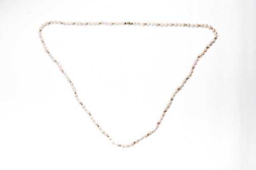 A semi baroque pearl necklace to a 14 carat yellow gold clasp