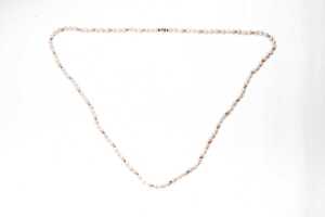 A semi baroque pearl necklace to a 14 carat yellow gold clasp