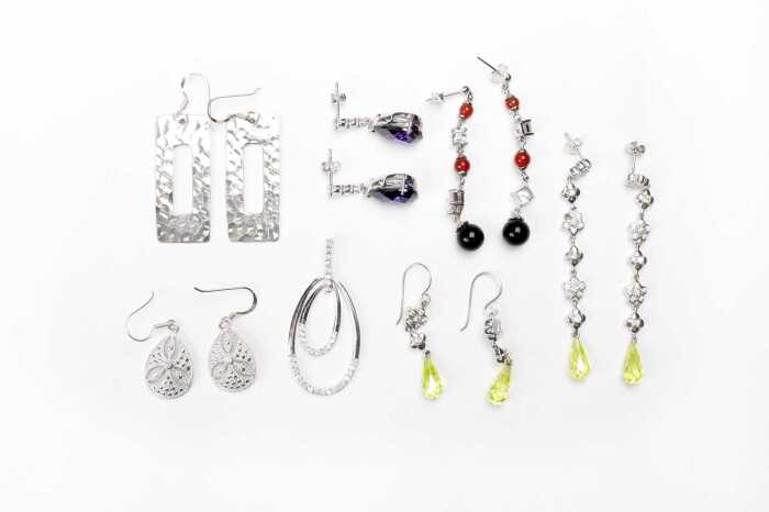 A collection of earrings and one pendant in sterling silver