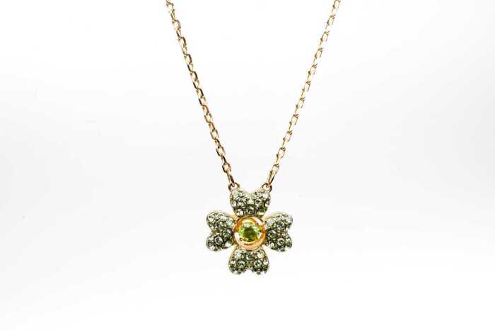 A Swarovski green Idyllia necklace in yellow gold tone