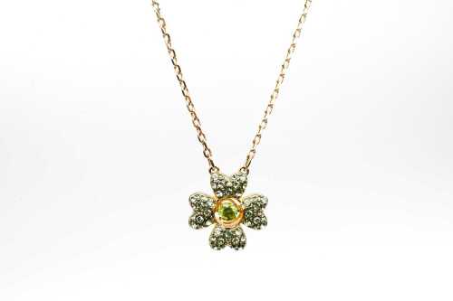 A Swarovski green Idyllia necklace in yellow gold tone