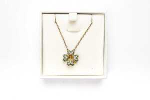 A Swarovski green Idyllia necklace in yellow gold tone - 5