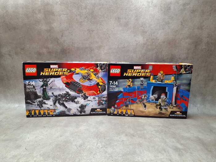 Two LEGO Super Heroes playsets.