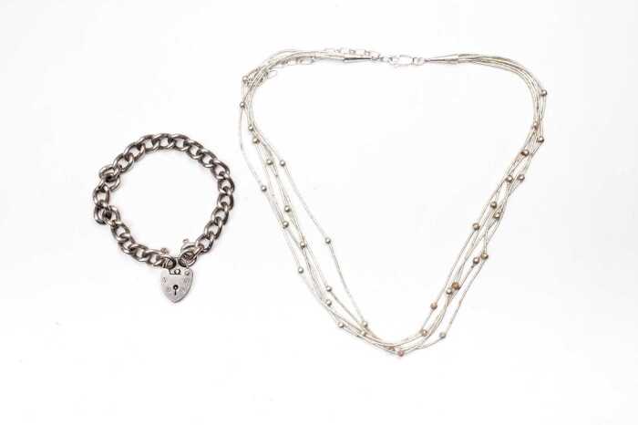 A necklace and padlock bracelet in sterling silver