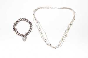 A necklace and padlock bracelet in sterling silver