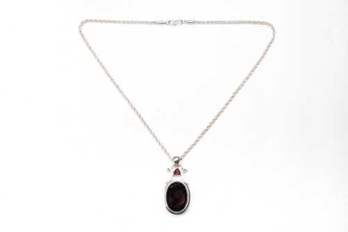 A garnet and smoky quartz pendant and necklace in sterling silver