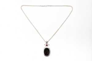 A garnet and smoky quartz pendant and necklace in sterling silver