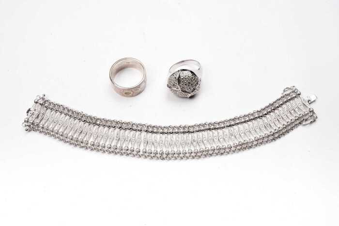 A bracelet and two rings in sterling silver