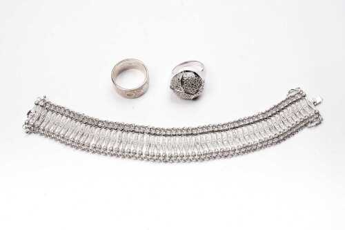 A bracelet and two rings in sterling silver