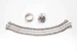 A bracelet and two rings in sterling silver
