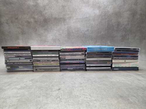 Assorted CDs, including Metallica and Queen