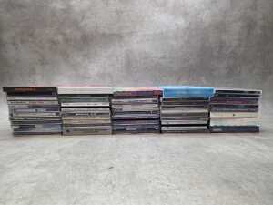 Assorted CDs, including Metallica and Queen