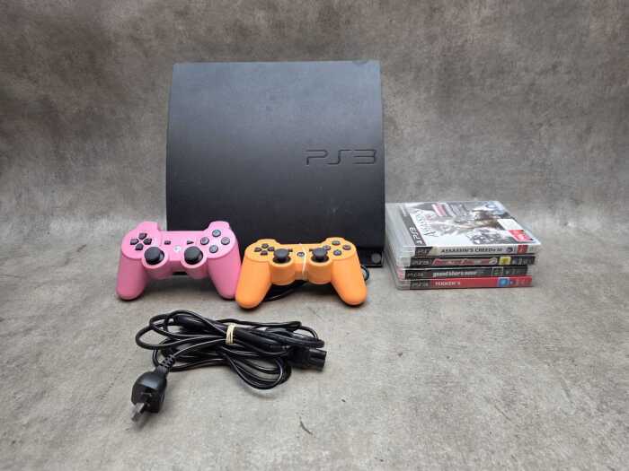 Sony PlayStation 3 with two controllers and games