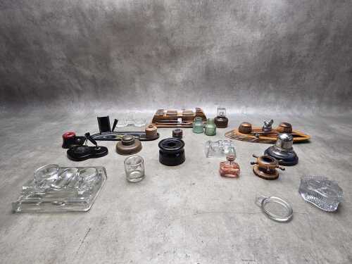 Collection of antique and vintage inkwells and pen rests