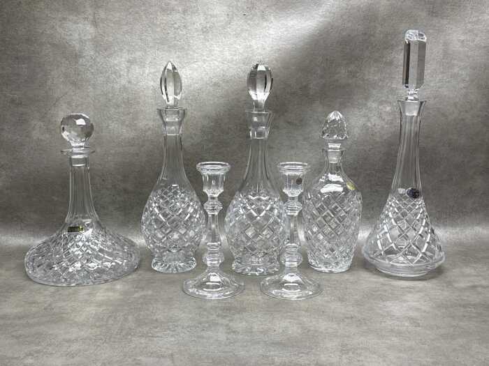 Cut crystal decanters and a pair of candlesticks