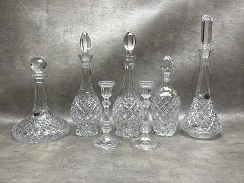 Cut crystal decanters and a pair of candlesticks