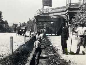 Black and white reproduction of early Australian photograph (The road makers). - 2