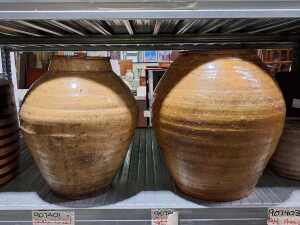 Two hand-made rustic terra cotta pots