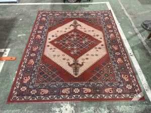 Red and pink power loomed rug