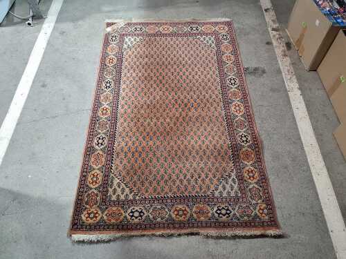 Vintage Indian hand-knotted wool and cotton rug with paisley design