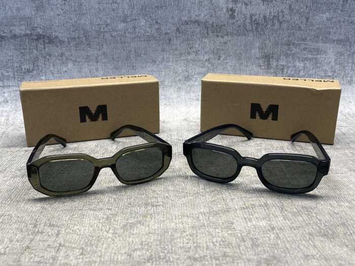 Two pairs of Meller sunglasses