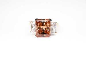 A cubic zirconia ring in 14 carat yellow gold