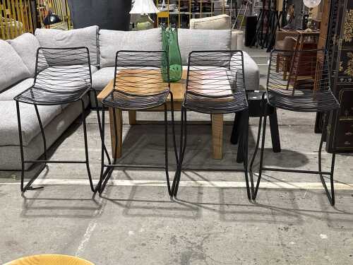 Set of four matte black metal wire bar stools